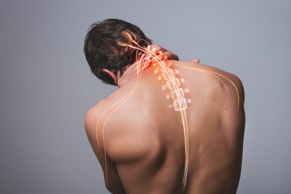Man in Pearland, TX holding his neck due to Cervical Radiculopathy Neck Pain